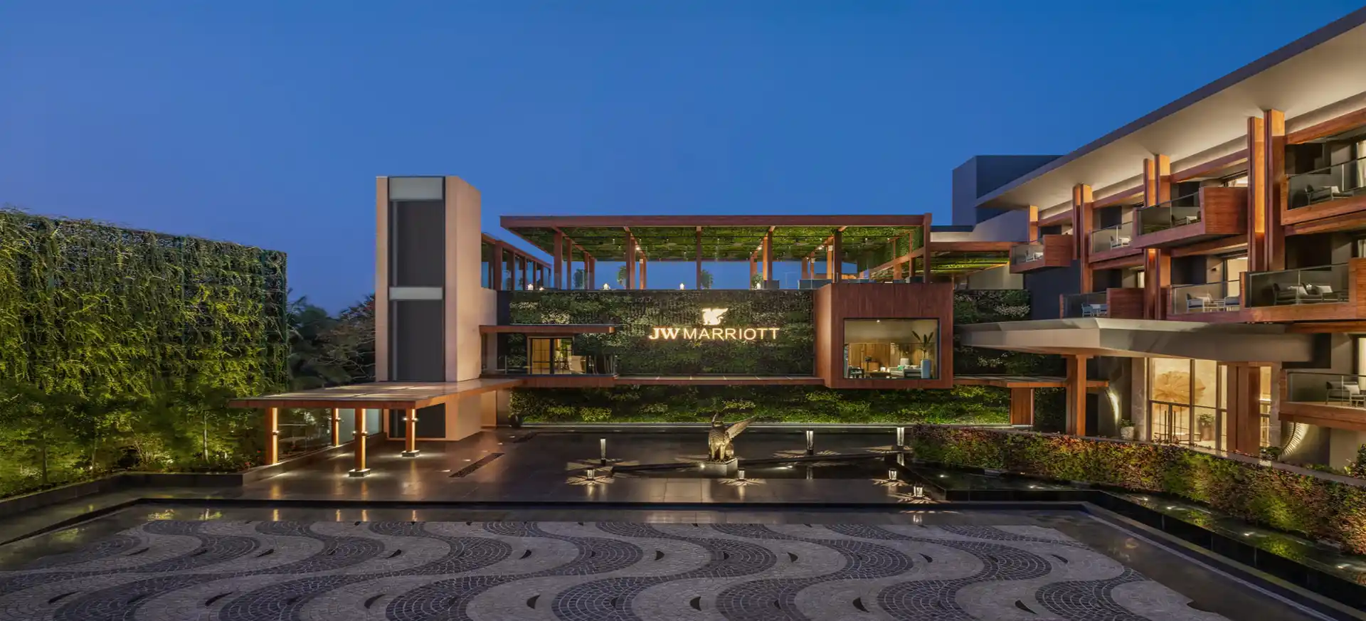 Award-winning hotel spa pool at dusk, still water and stone.